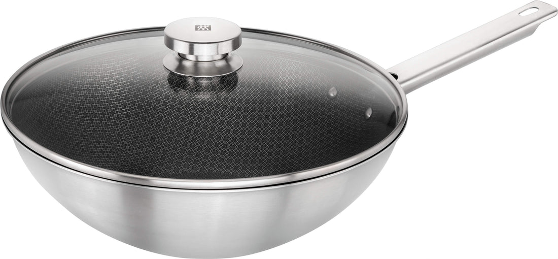 ZWILLING JOY PLUS Wok 30 cm in German is &quot;ZWILLING JOY PLUS Wok 30 cm.&quot; The product name remains the same as it is a brand and specific product designation.
