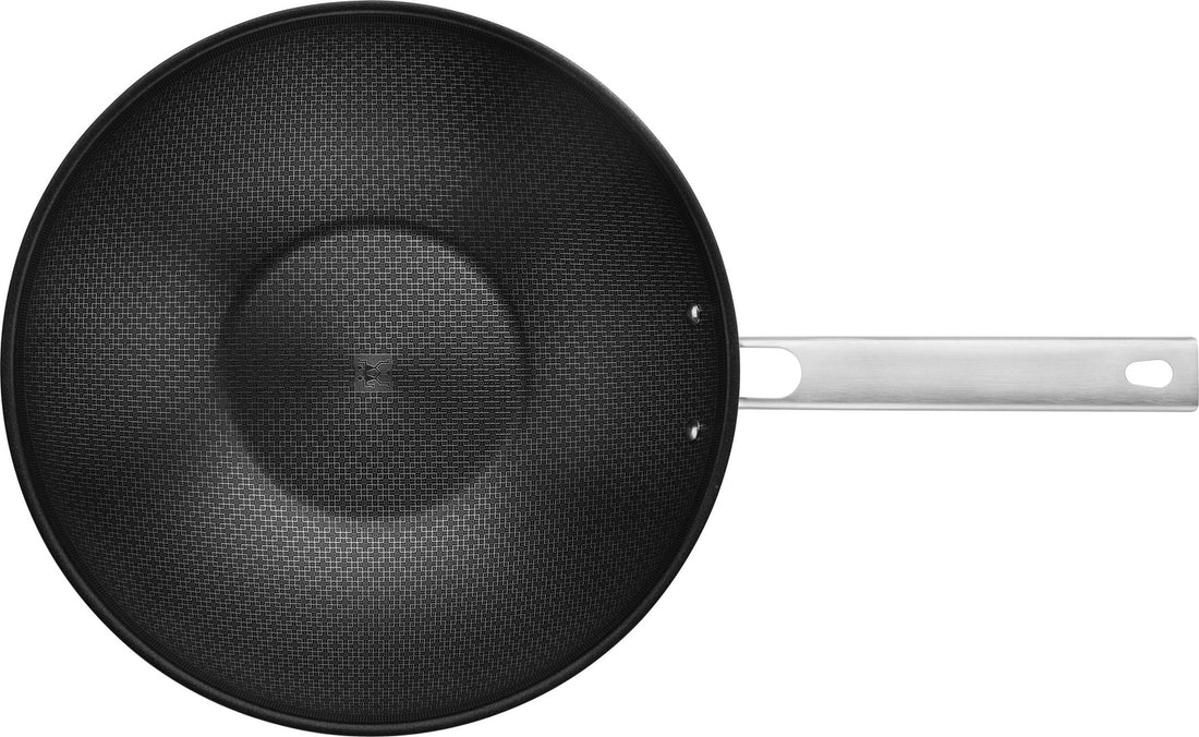 ZWILLING JOY PLUS Wok 30 cm in German is &quot;ZWILLING JOY PLUS Wok 30 cm.&quot; The product name remains the same as it is a brand and specific product designation.