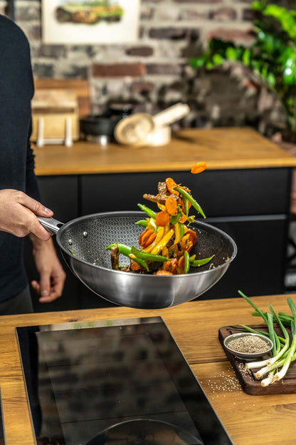 ZWILLING JOY PLUS Wok 30 cm in German is &quot;ZWILLING JOY PLUS Wok 30 cm.&quot; The product name remains the same as it is a brand and specific product designation.